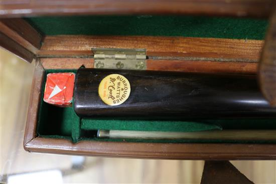 An ivory and silver handled cane, a leather cased snooker cue and a shooting stick